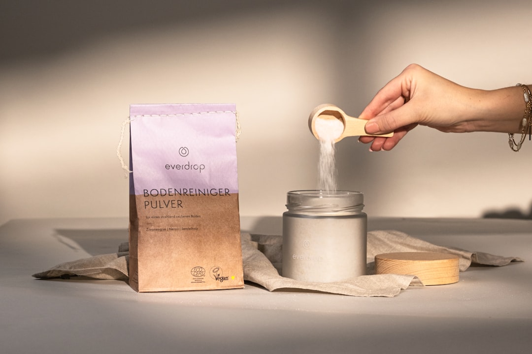 a-person-holding-a-spoon-over-a-jar-of-food-j5n5zk-brdo